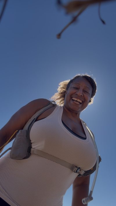 Thumbnail of a person lying on the ground doing a corrective movement exercise.