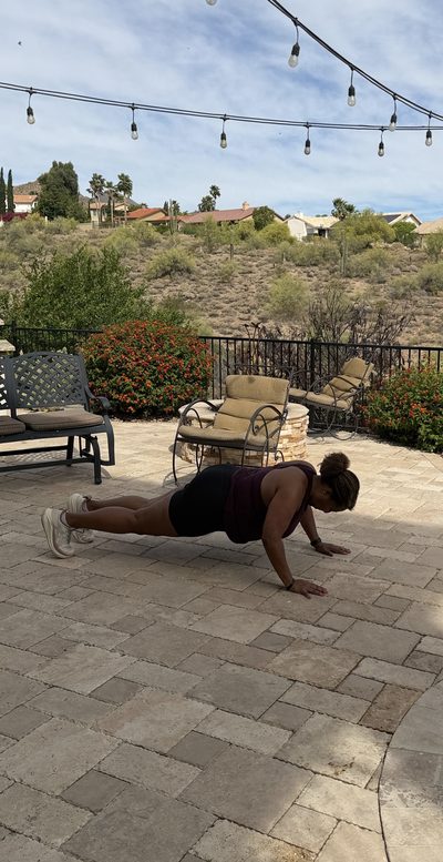 Thumbnail of a woman holding a plank or push-up position.