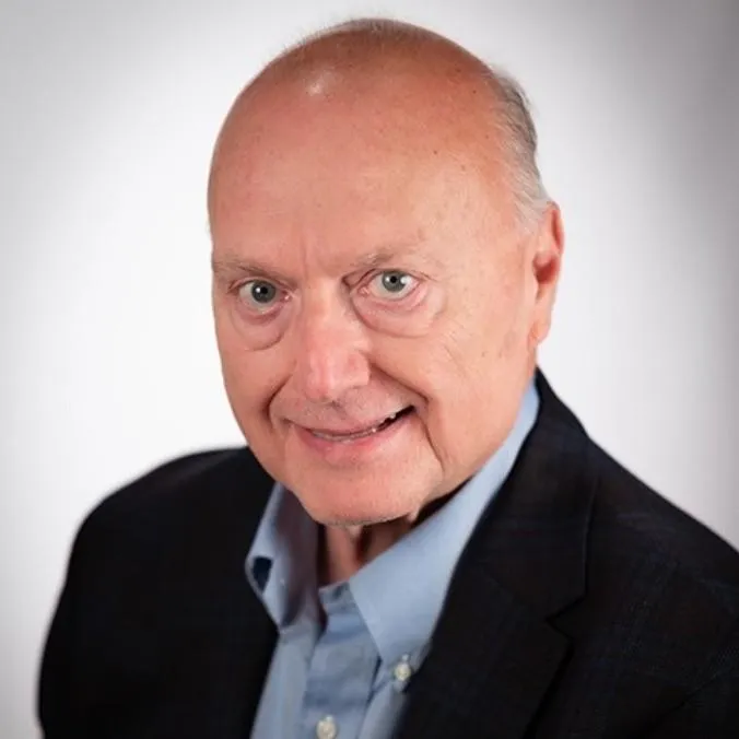 selective focus photography of people sits in front of table inside room