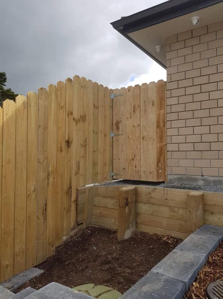 Timber boundary fence and gate beside an Auckland home