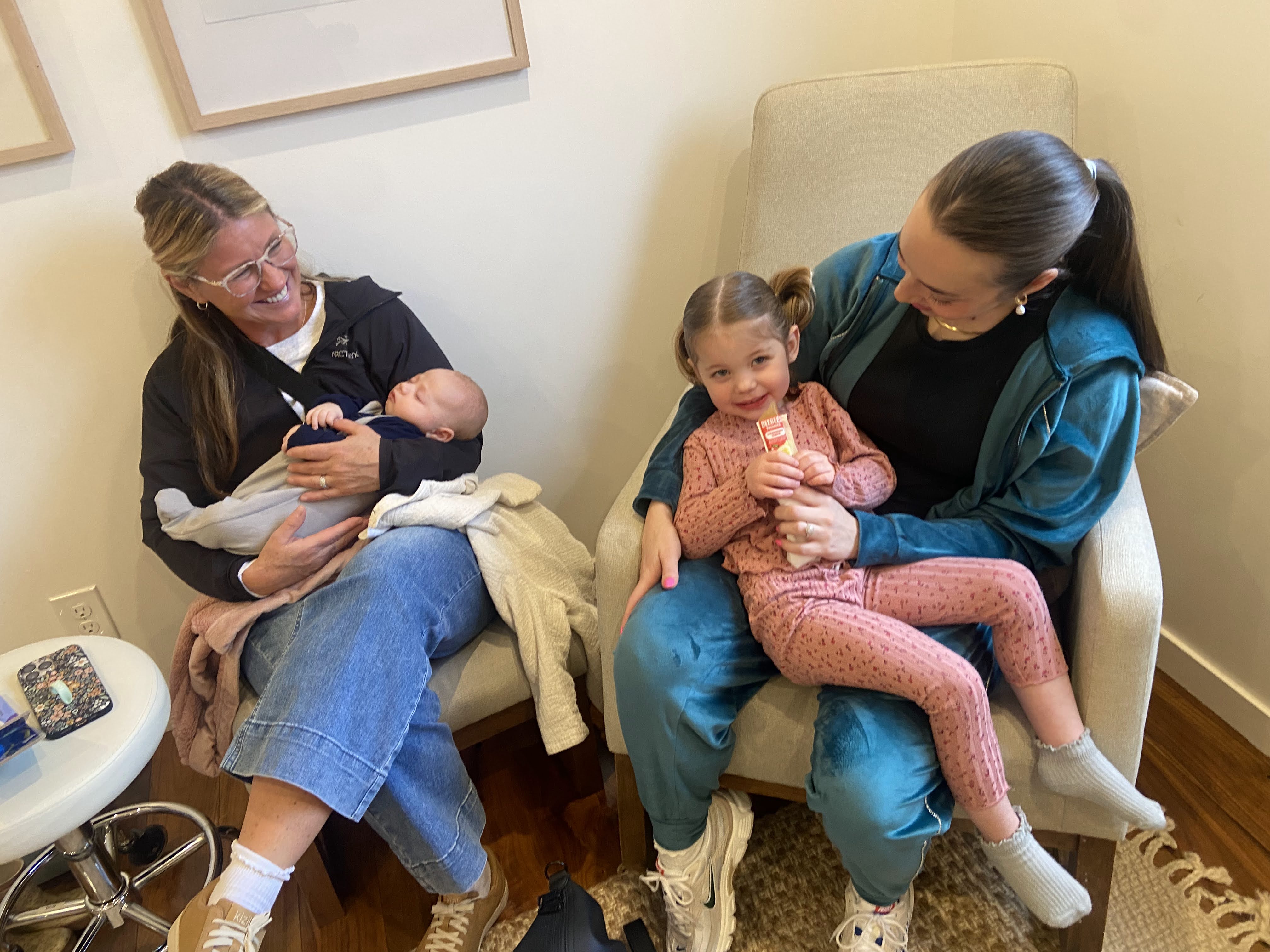 Calm mother holding baby in a wellness clinic