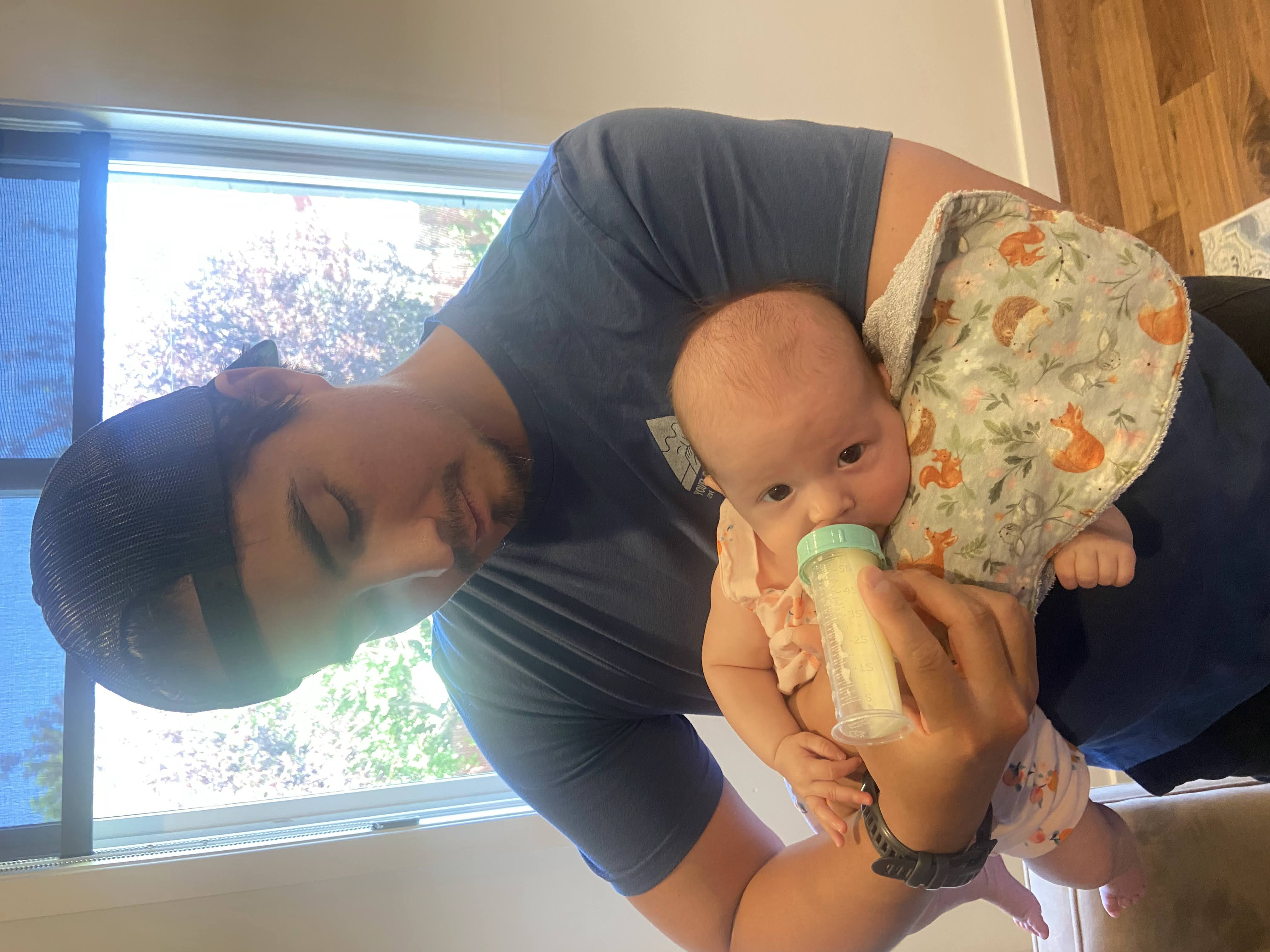 Clinical professional holding baby