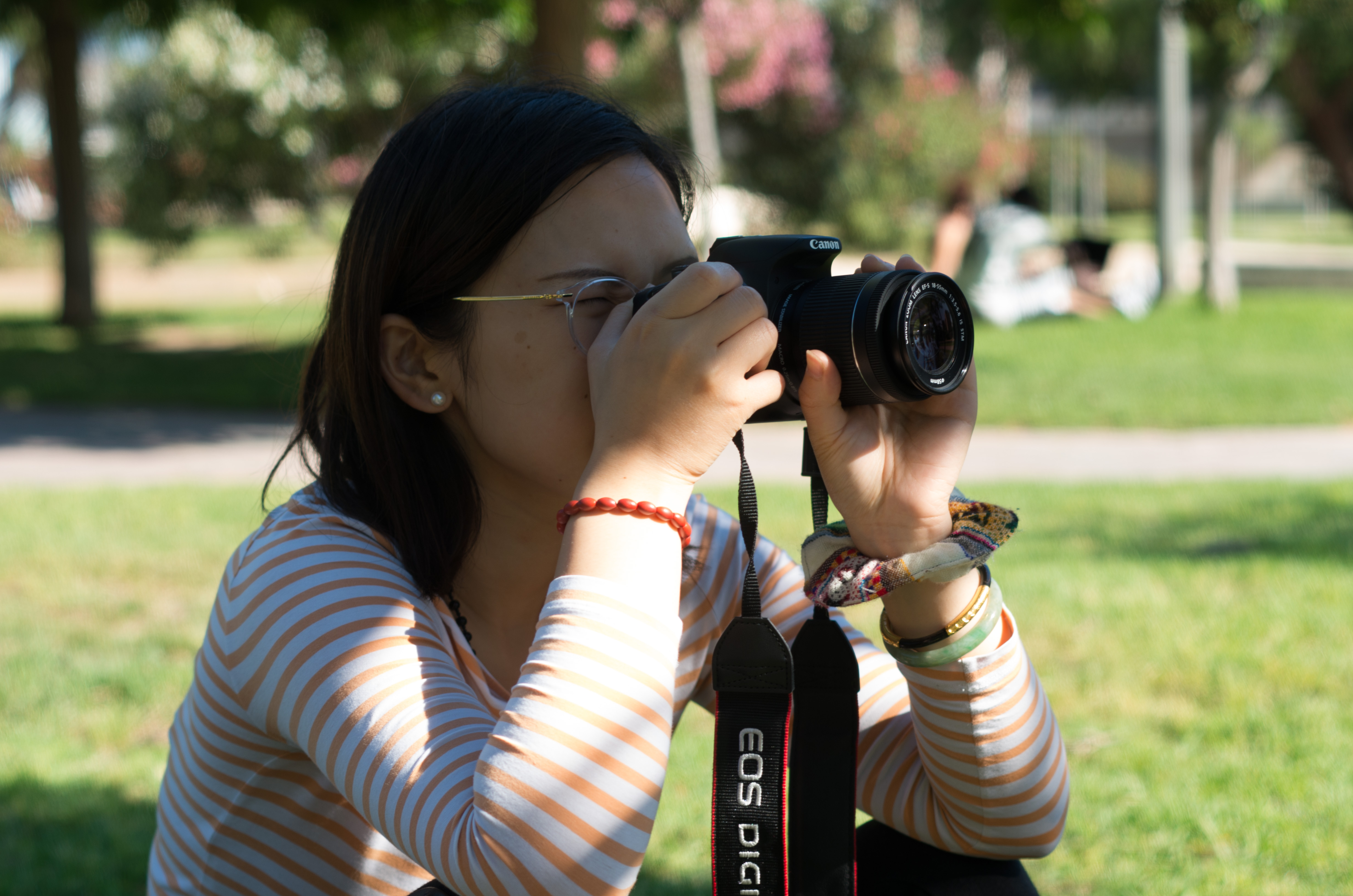 a person taking a photo with their phone of valencia's graffiti during a photo walk