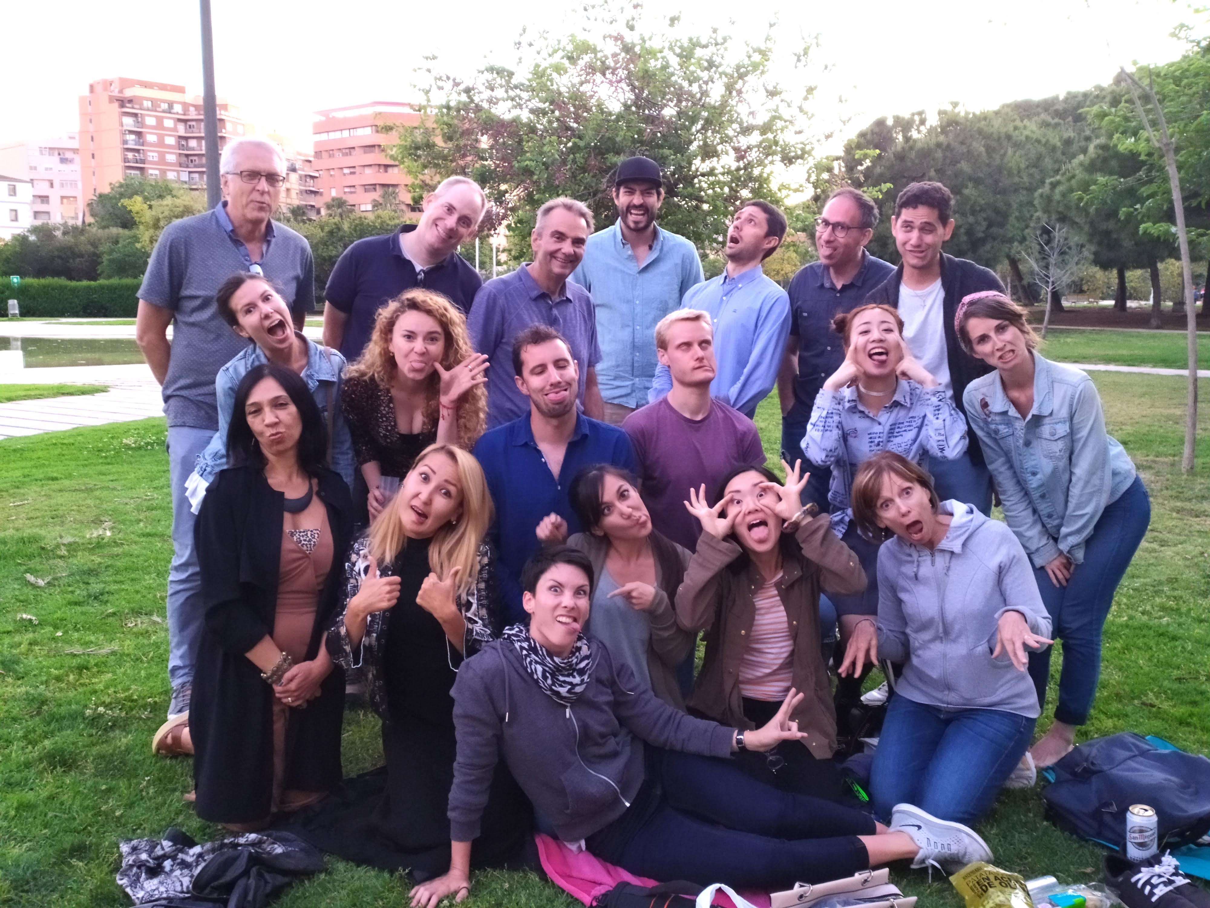 A group of people from the ValenFoto community in Valencia posing with silly faces after an outdoor photo workshop