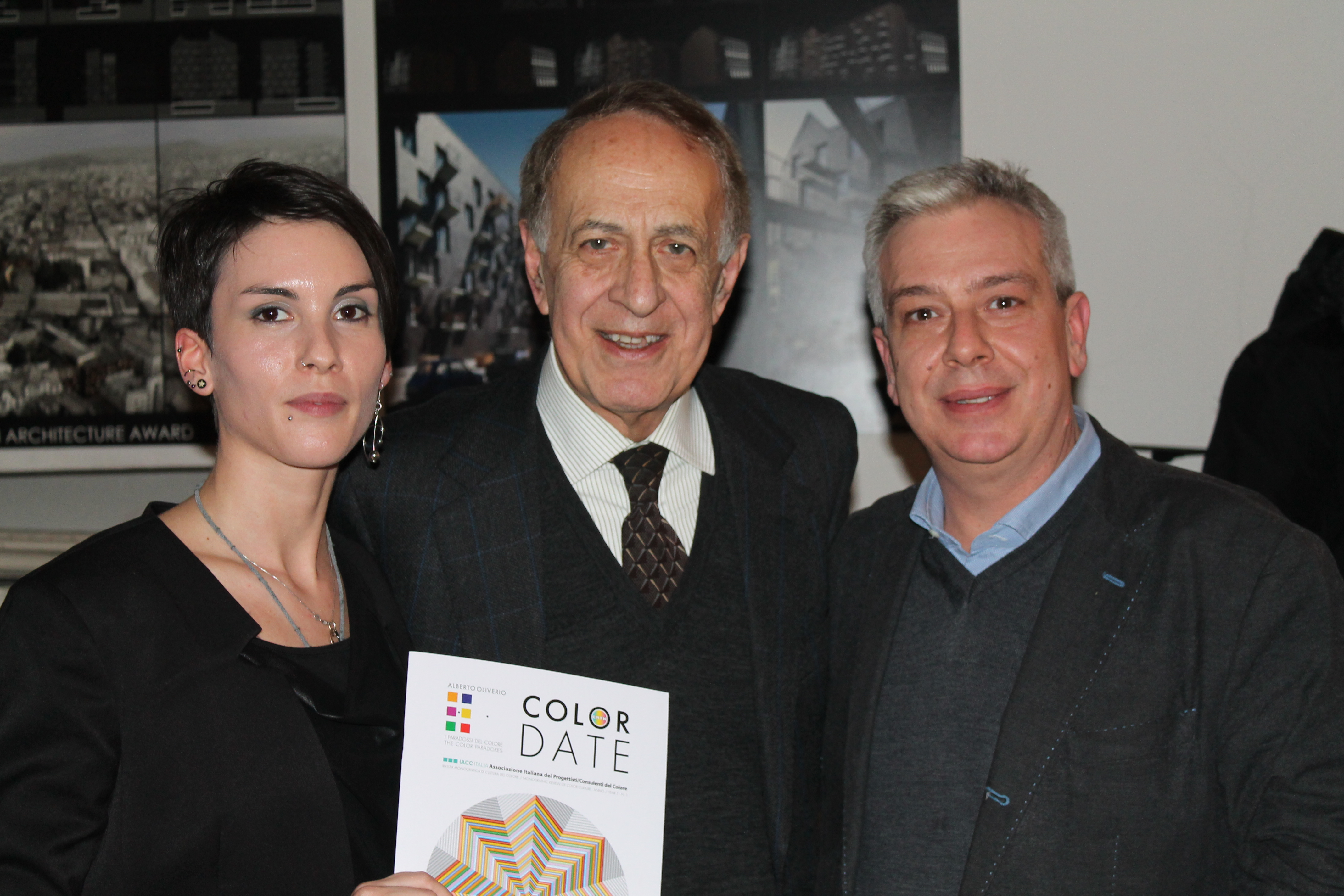 A photo of Alberto Oliverio, Massimo Caiazzo and Meg Rouje standing together during the event for Color Date Magazine in 2014