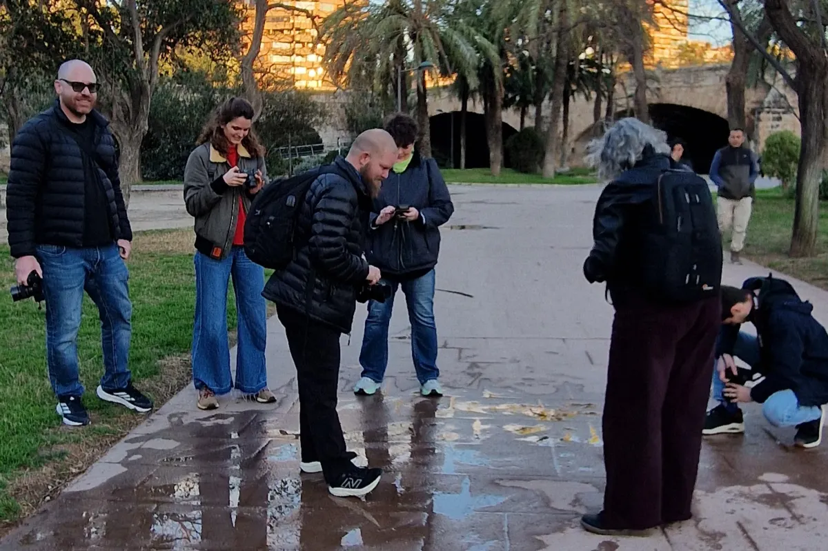 a woman taking photos at the science museum architecture during a private photography workshop