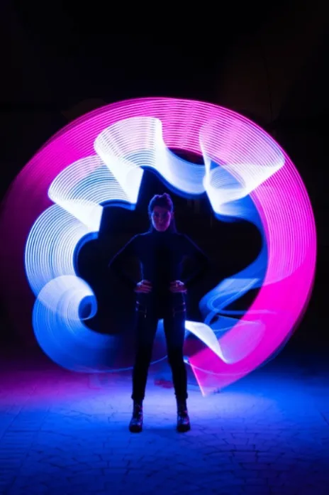 the cone architecture at the city of arts creating a powerful image with a woman walking towards the camera
