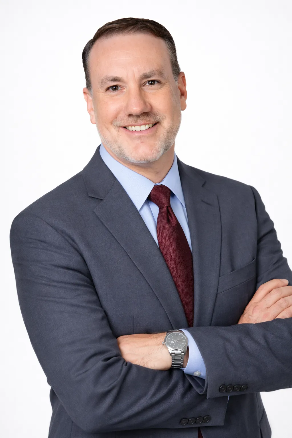 Portrait of business coach Avery Hale, mid-40s professional with warm friendly posture, studio-lit background with pale tones.