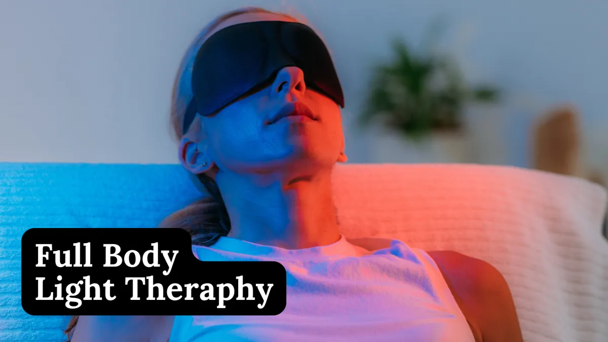 woman in white bathtub holding clear drinking glass