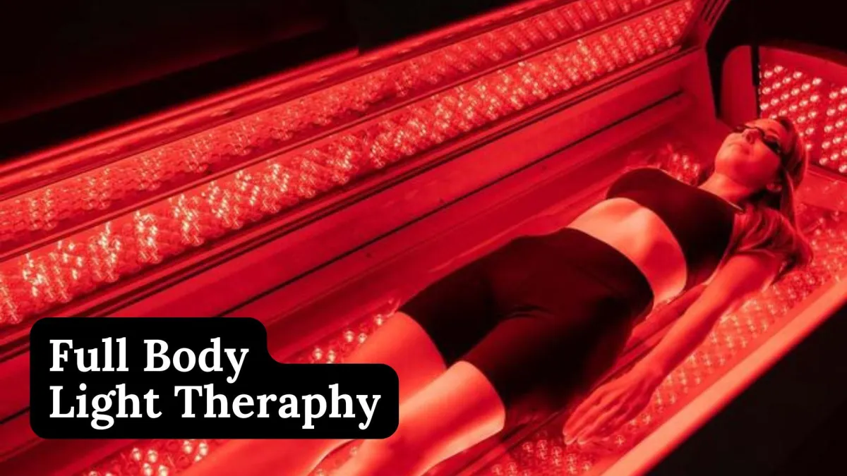 woman in white bathtub holding clear drinking glass