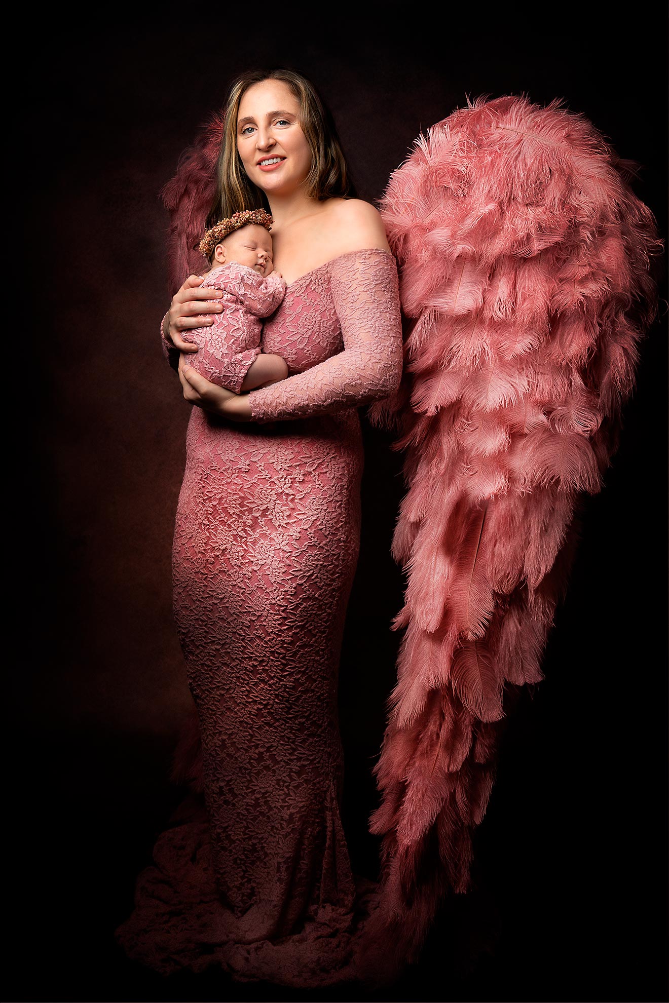 Mother tenderly holding her newborn child