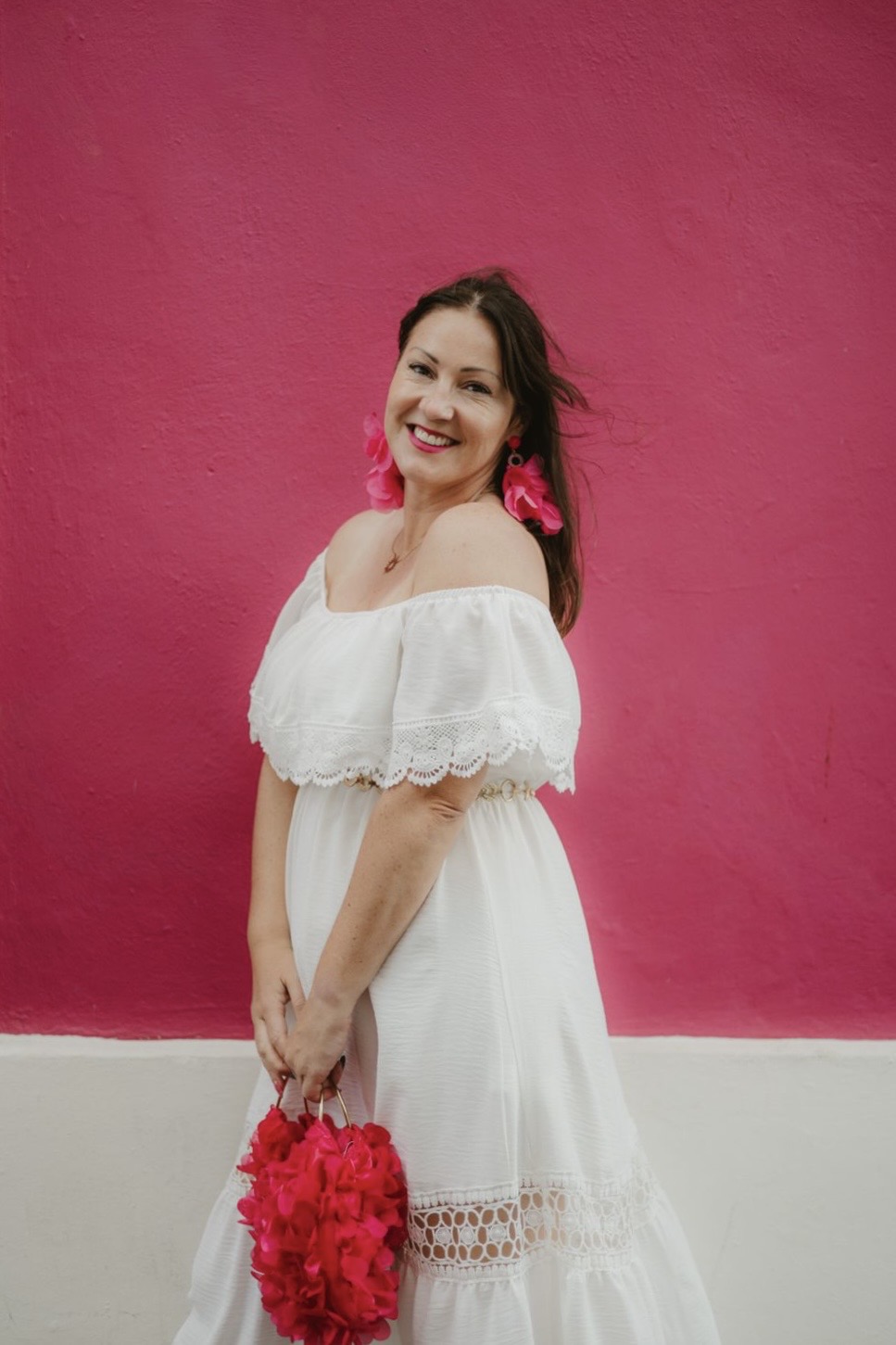 Naomi Morgan against a hot pink wall