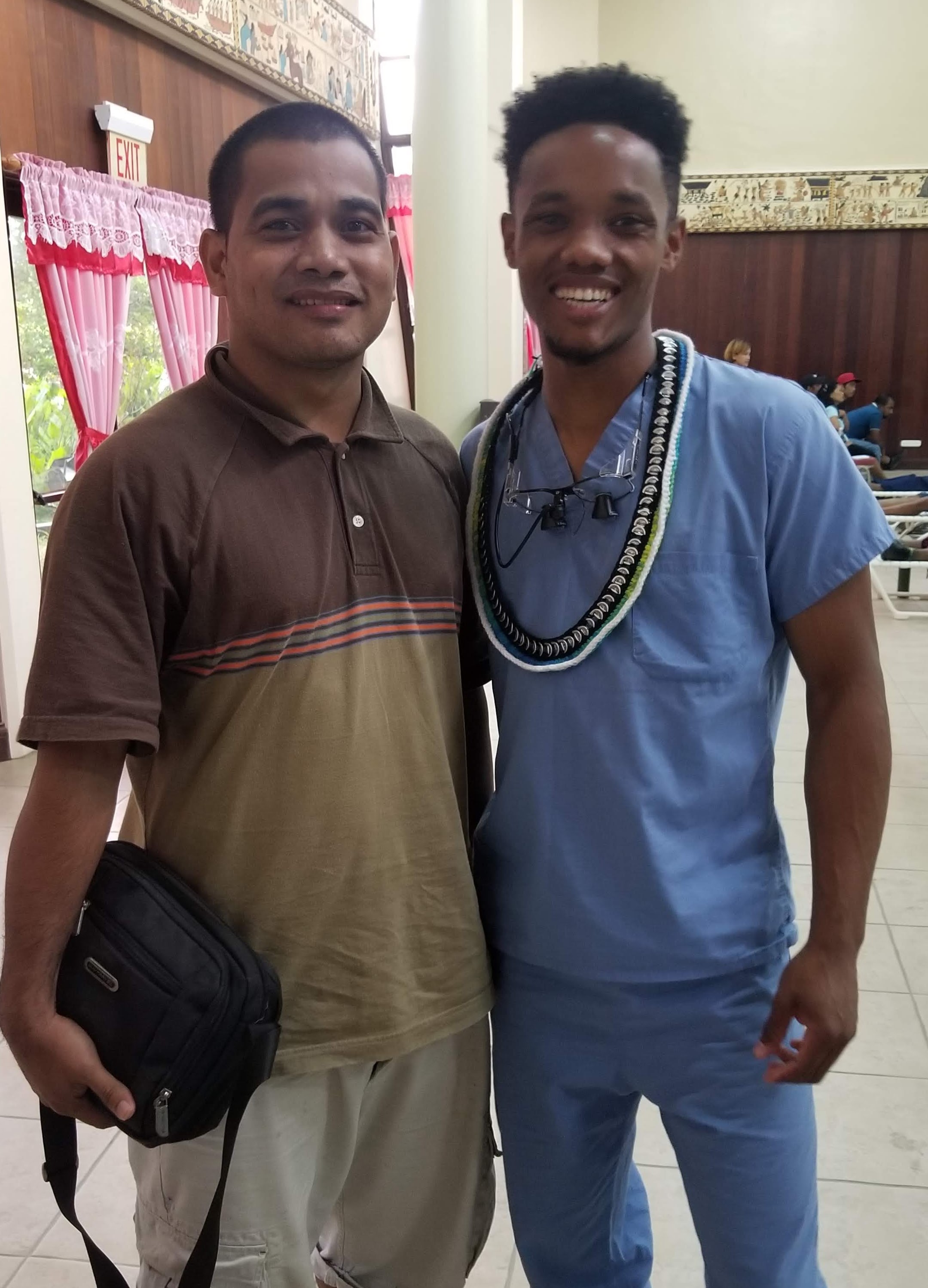 Dr. Wongk with a community member just after a tooth extraction