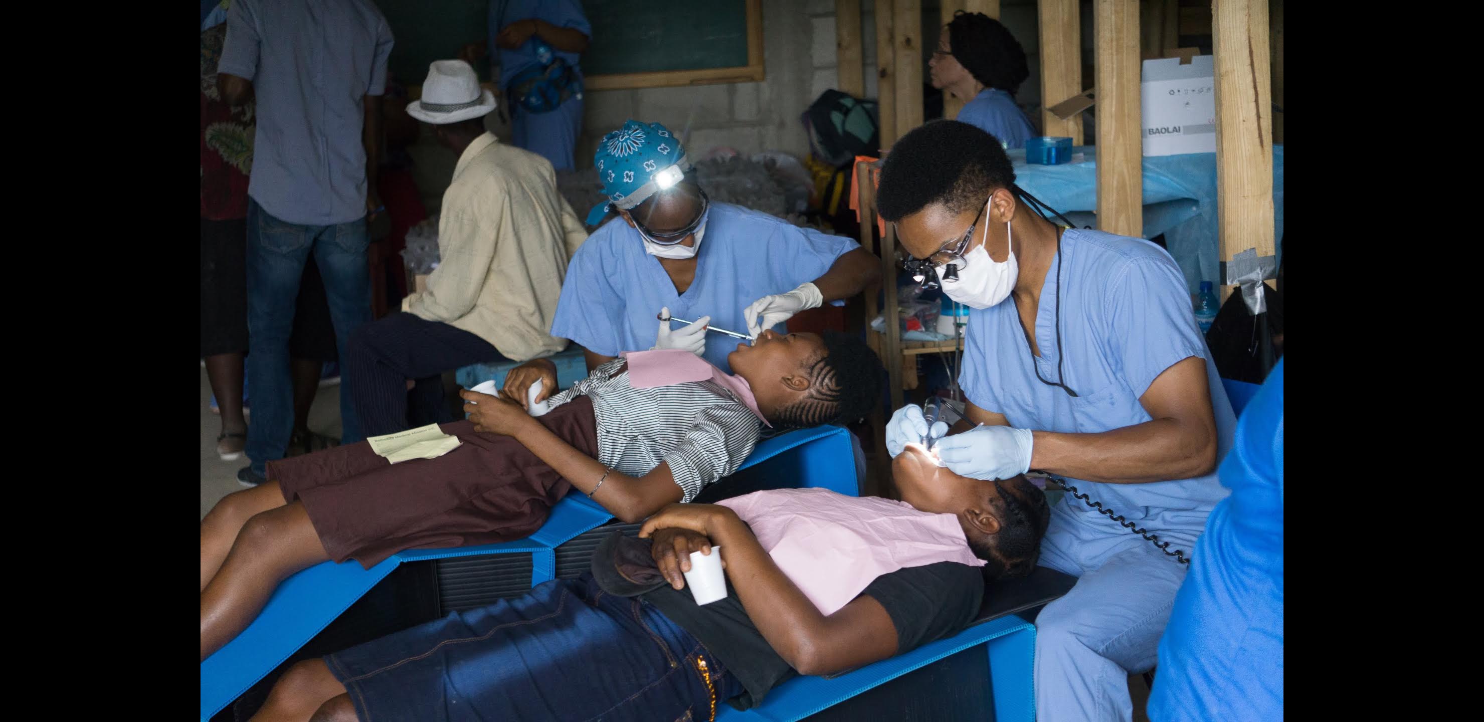 Dr. Wongk providing free dental care on a mission trip