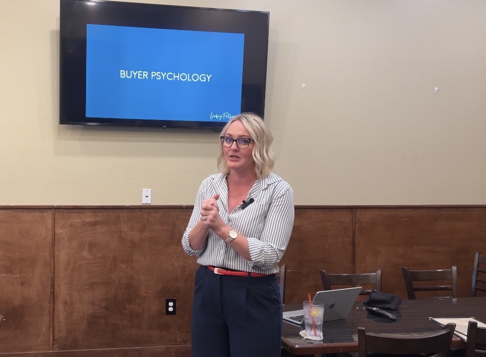 Lindsay Fletcher speaking about buyer psychology and selling to a group of Christian Women in Business in The Woodlands, Texas.