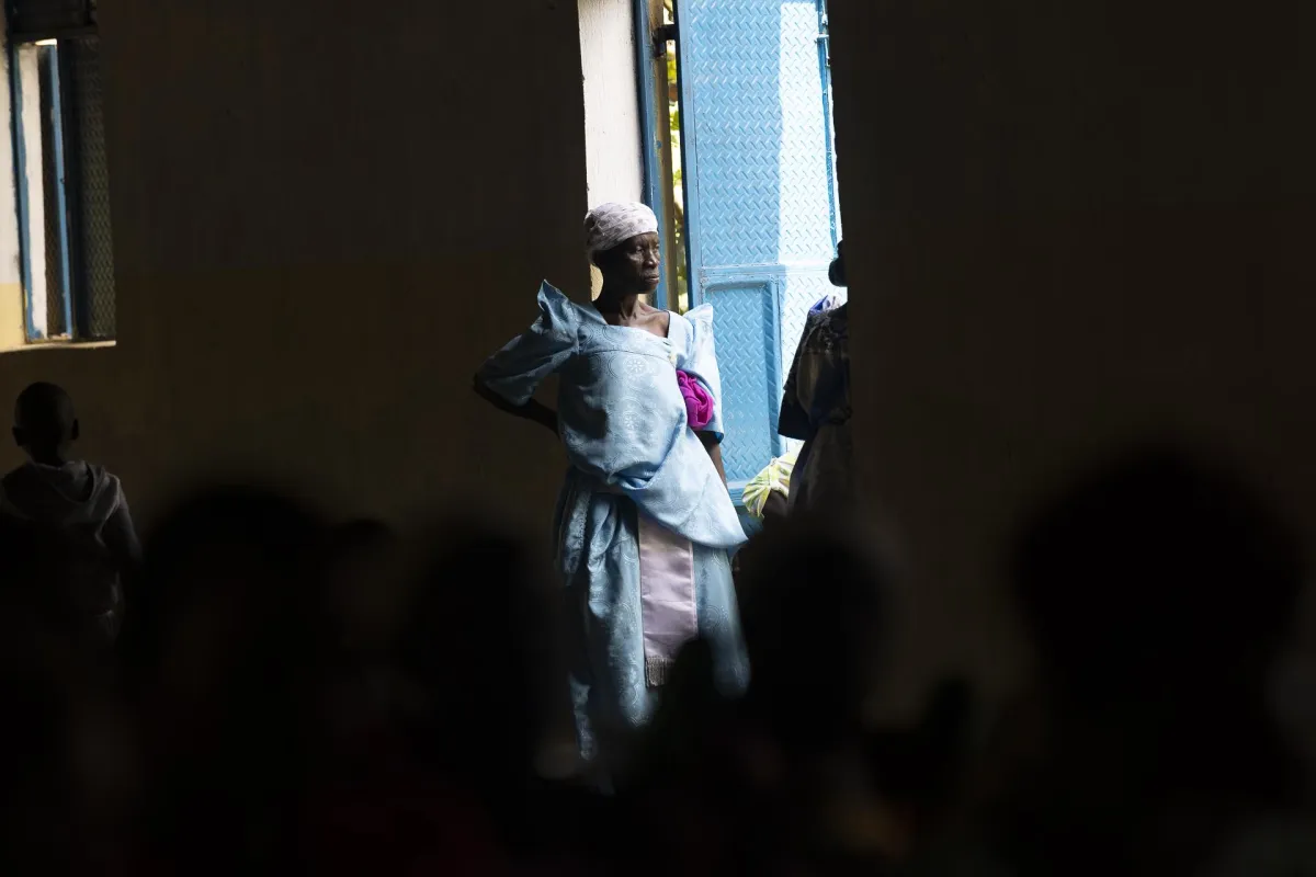 Ugandan church mother participating in church service