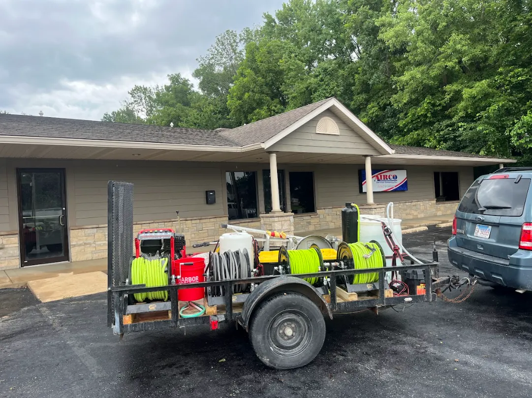 Residential pressure washing technician cleaning home exterior in Troy Edwardsville Illinois