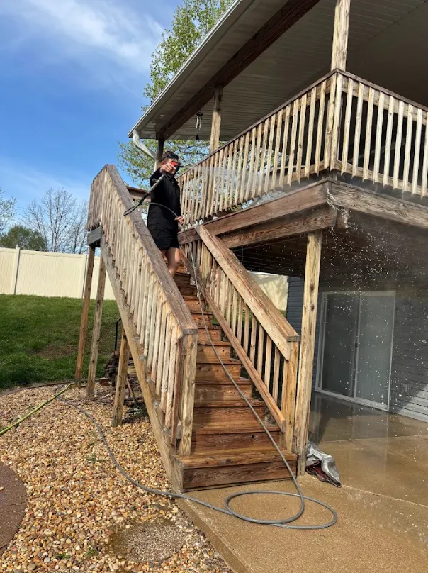 Red Carpet Pro Wash technician pressure washing a brick home in Troy, Illinois