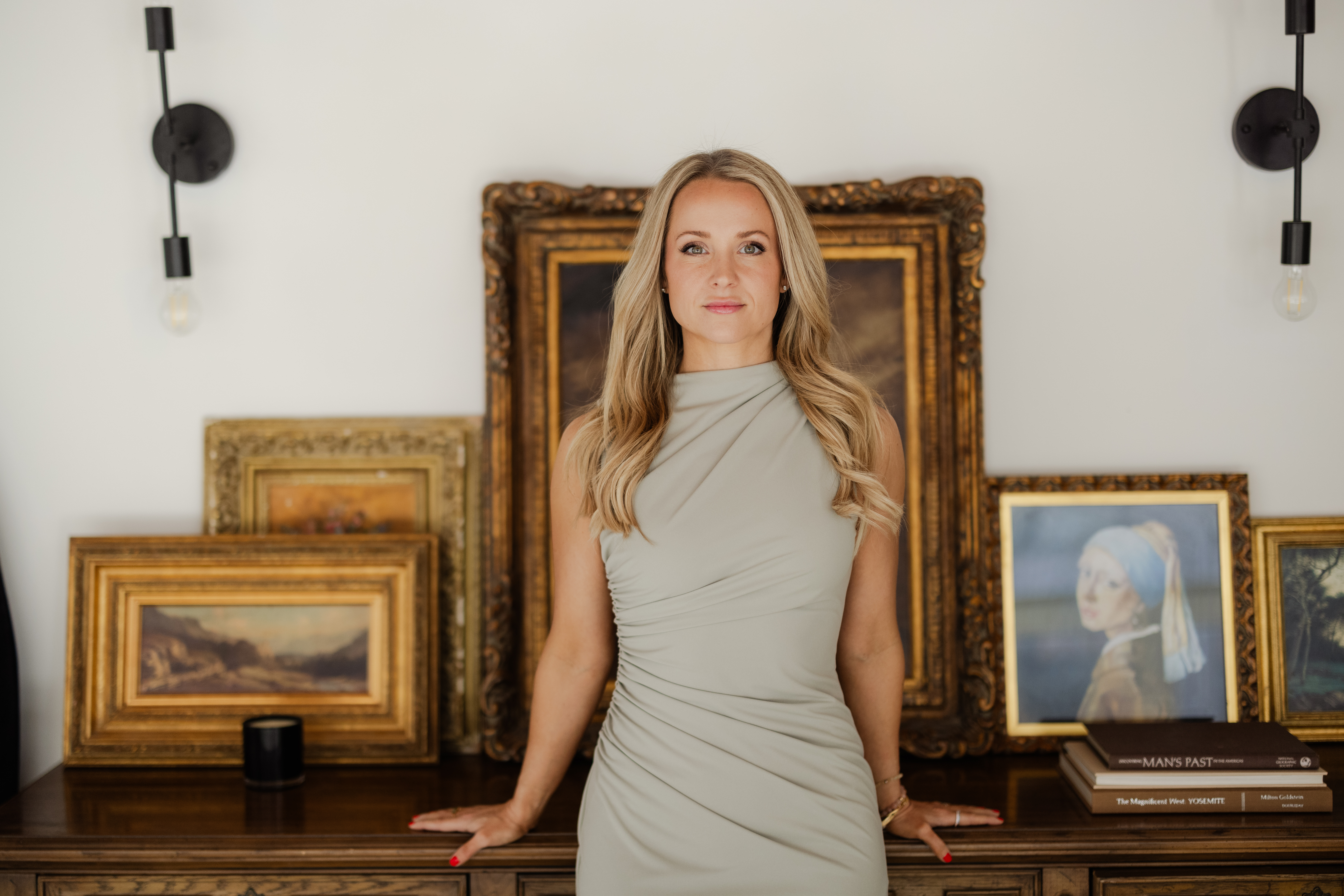 Photo of Dr Summer infront of Victoriann Frames