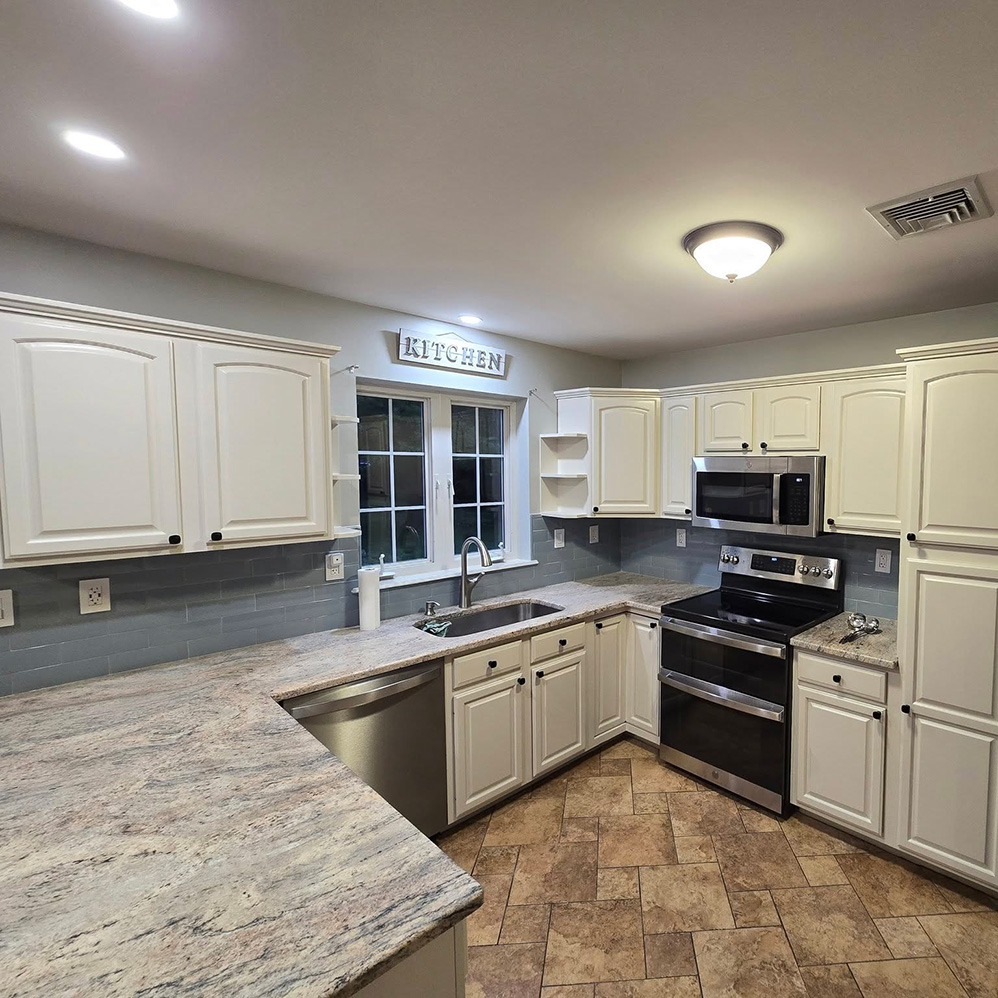 After interior kitchen painting with bright cabinets