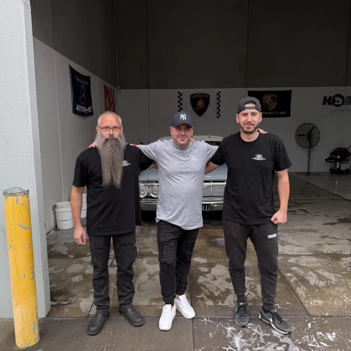 Melbourne Car Spa team standing in front of classic car