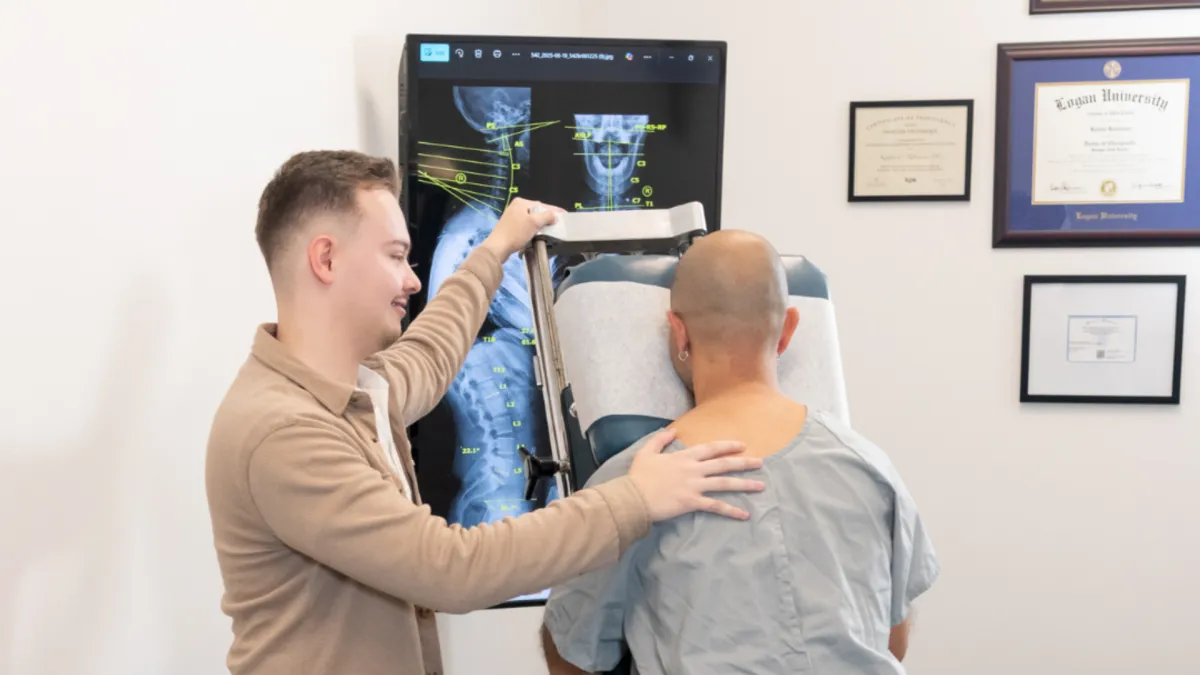 Chiropractor performing a Gonstead examination in O'Fallon Missouri