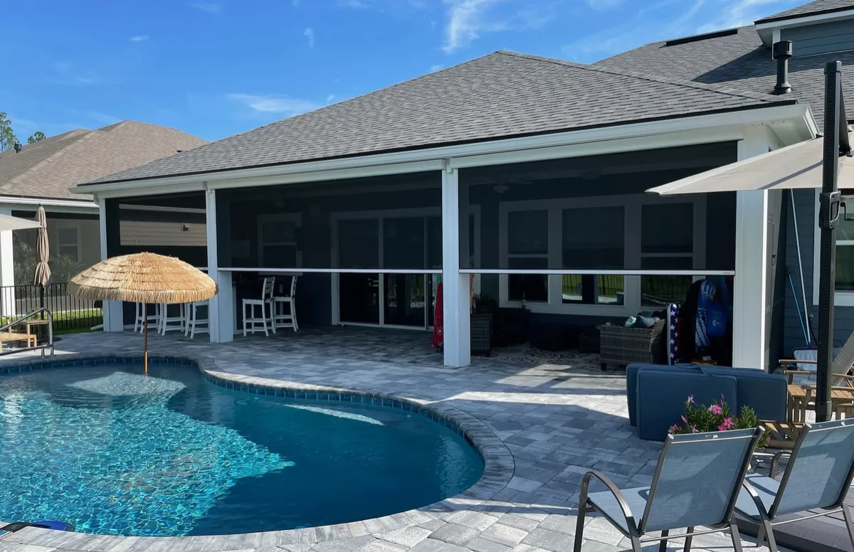 Motorized patio screens on a Florida pool lanai, installed by Florida Living Outdoor