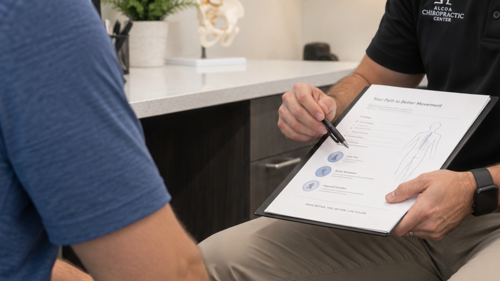 Chiropractor talking with a new patient before an examination