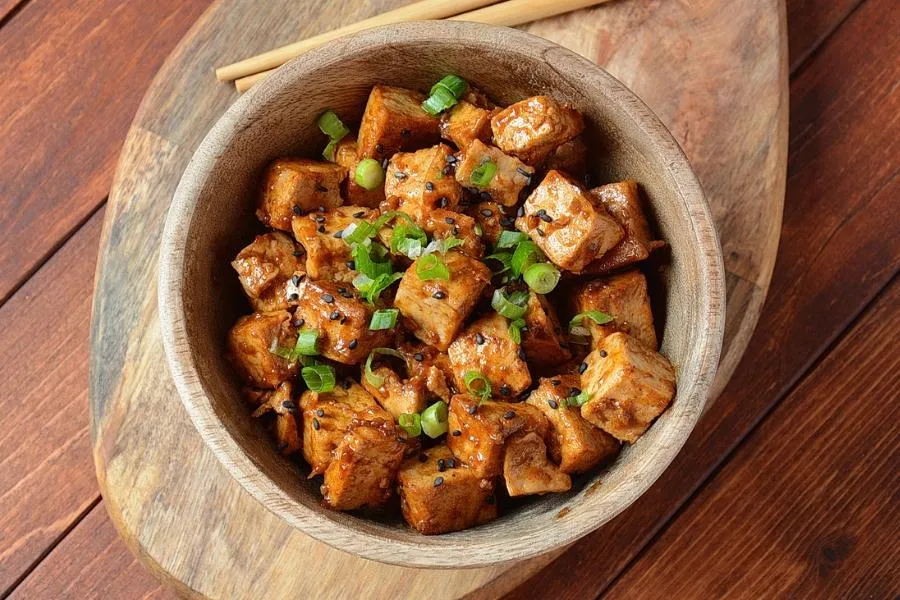 Tofu is a versatile vegan protein source containing iron and calcium