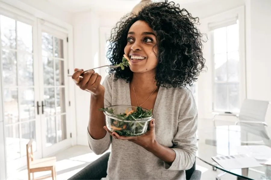 woman eating salad