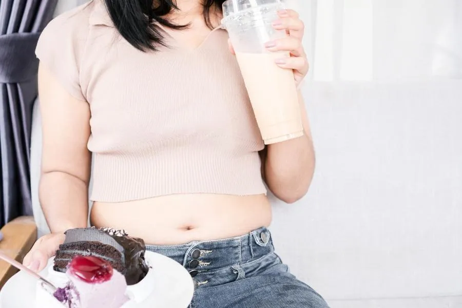 woman drinking milkshake