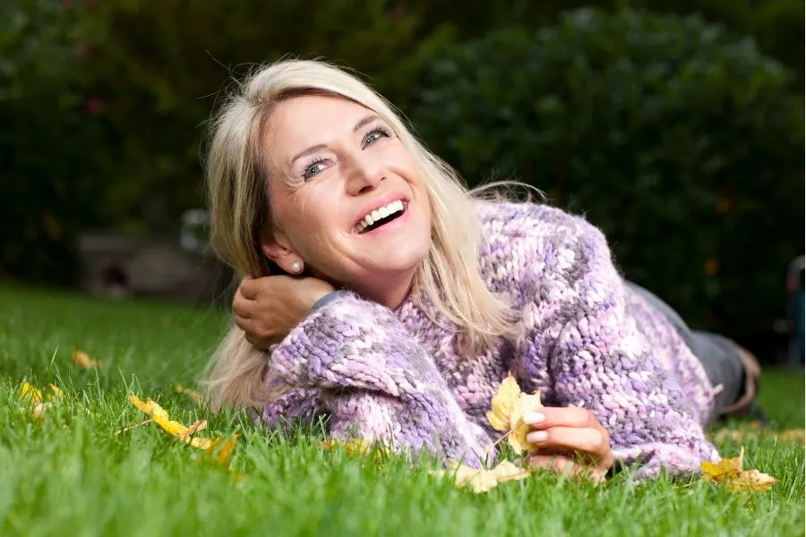 woman lying on grass