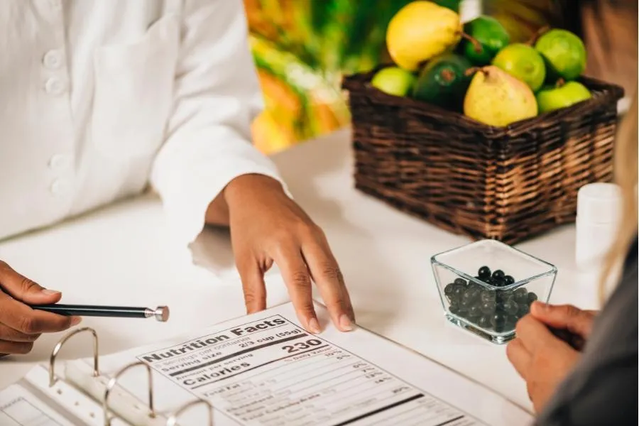 woman showing nutrition information