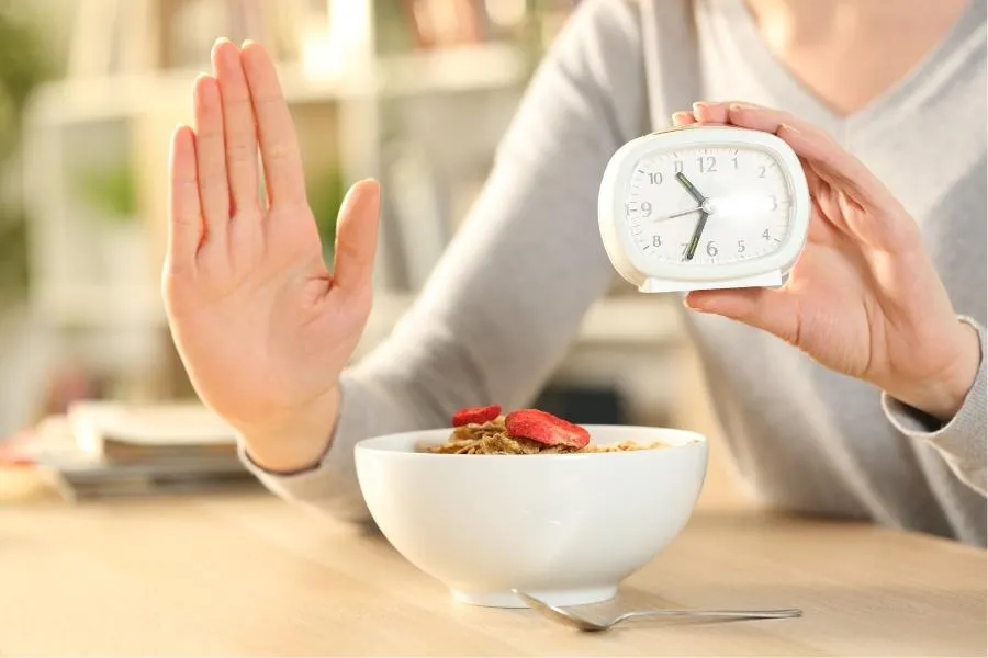 woman holding clock