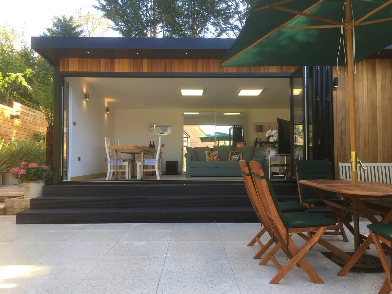 Modern garden room with integrated terrace and planting, designed and built by EarthCare Gardens in Wallington, South London
