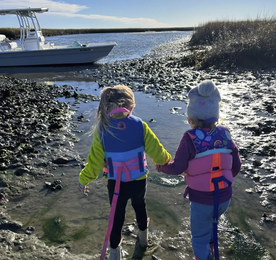 Kids and a family on an eco tour boat charter