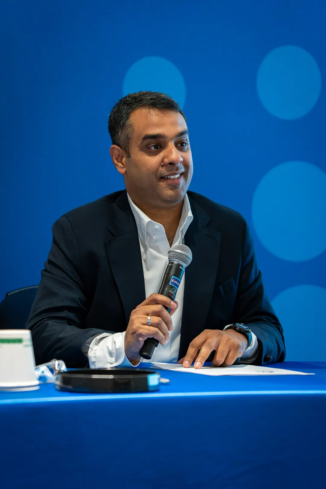 Business coach presenting growth strategies and key performance metrics on a whiteboard during a professional coaching session.