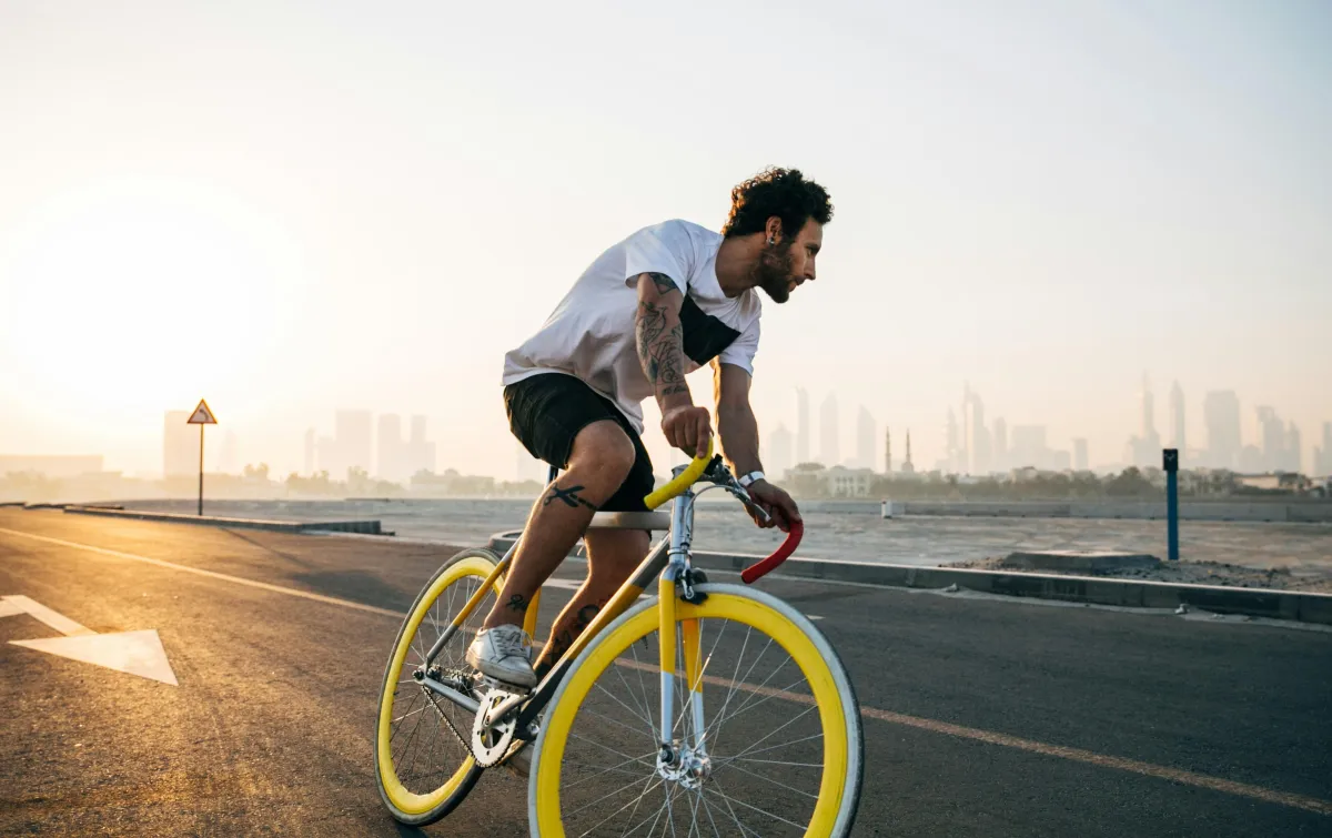 Man riding bike image