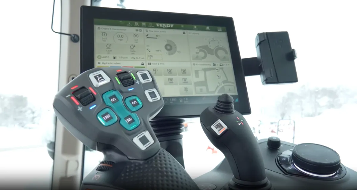 red and black tractor surrounded with tall and green trees