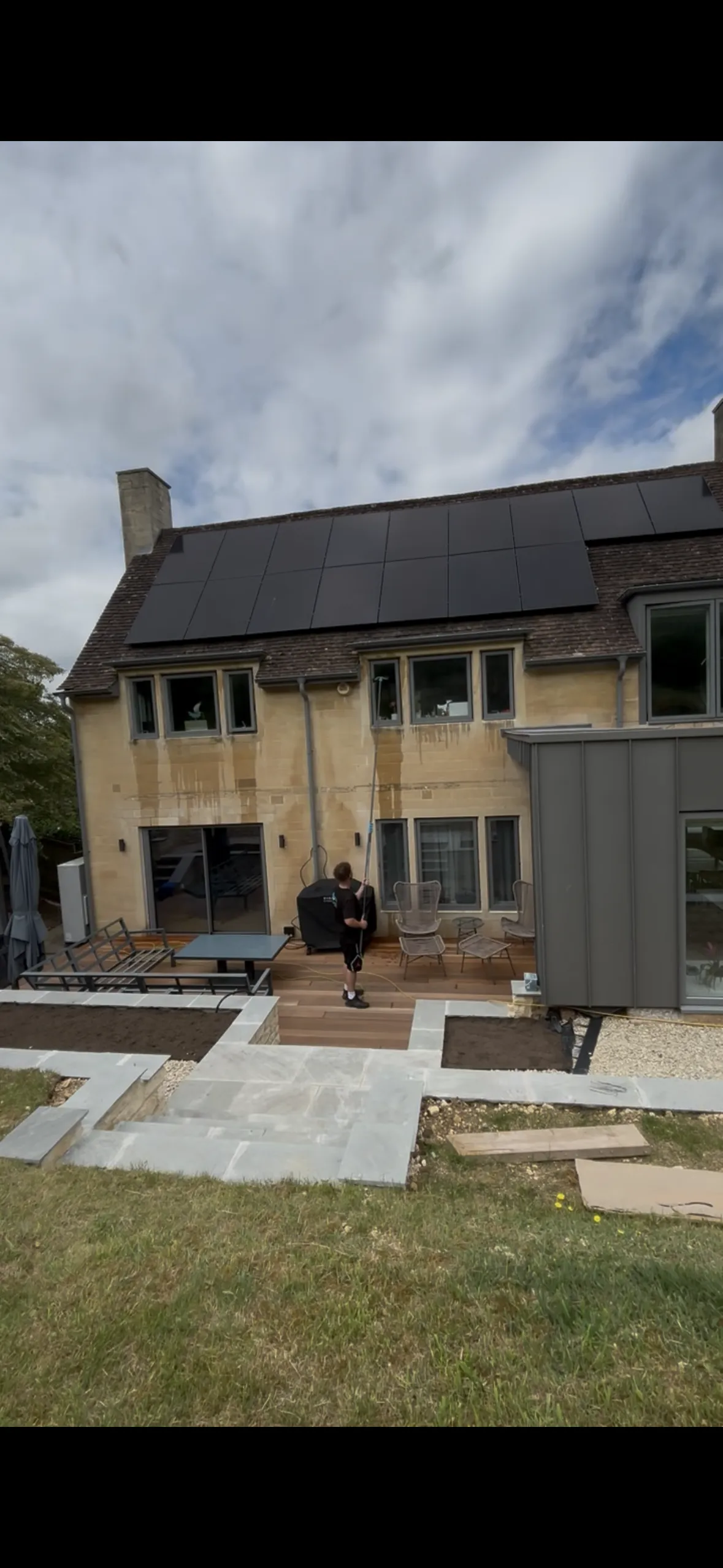 Solar panel cleaning on a house roof in Bath