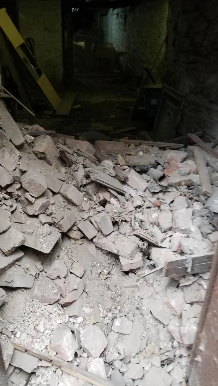 "Rubble from a collapsed wall at a Bronx workplace, showing the aftermath of an accident that injured our client. Our Bronx workplace injury lawyers help victims seek compensation for job-related injuries."