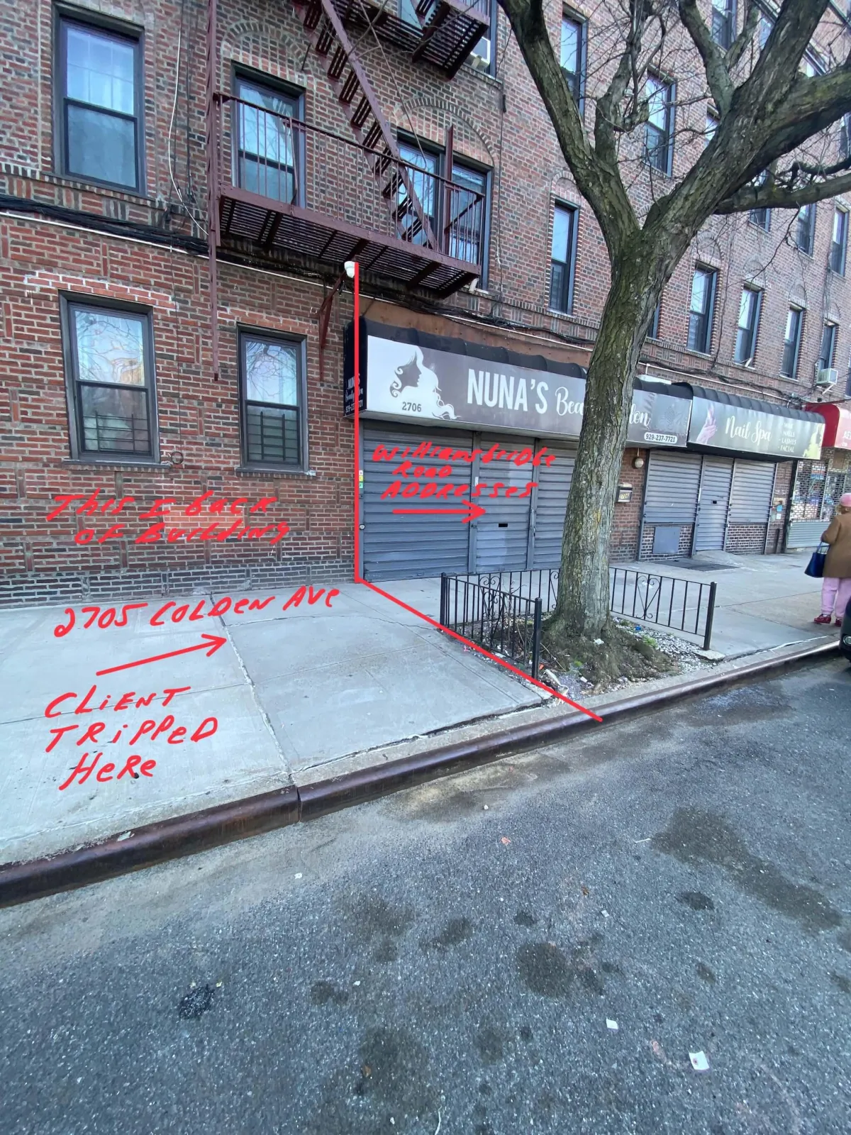 A Bronx sidewalk adjacent to a residential building with a visible defect where our client tripped and fell. Our Bronx landlord accident attorneys help victims seek compensation for injuries caused by negligent property maintenance