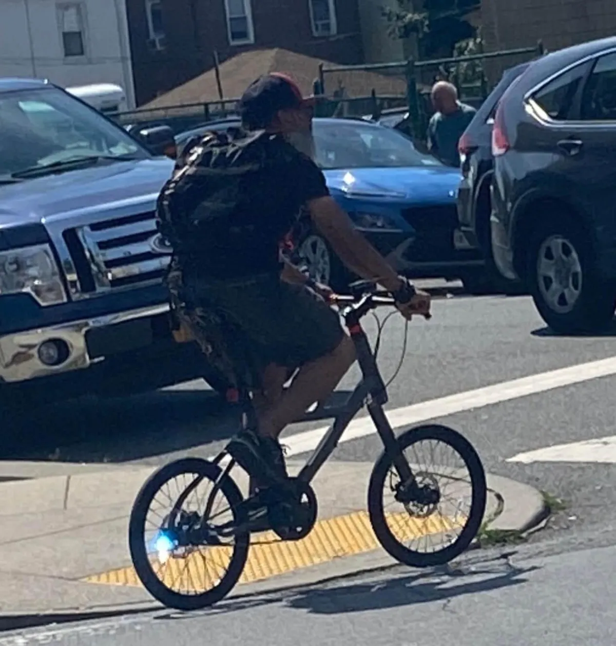 Our client riding his bicycle in the Bronx before being struck by a car, highlighting the risks cyclists face. Our Bronx bicycle accident lawyers help victims seek compensation for injuries