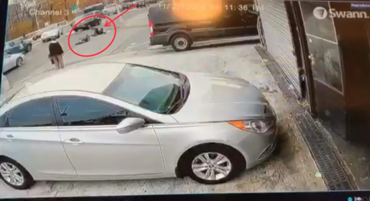 A security camera image showing a motorcycle accident at Gun Hill Road and Webster Avenue in the Bronx, where our client and their motorcycle were struck by a car. This location page highlights legal services for motorcycle accident victims in Gun Hill.