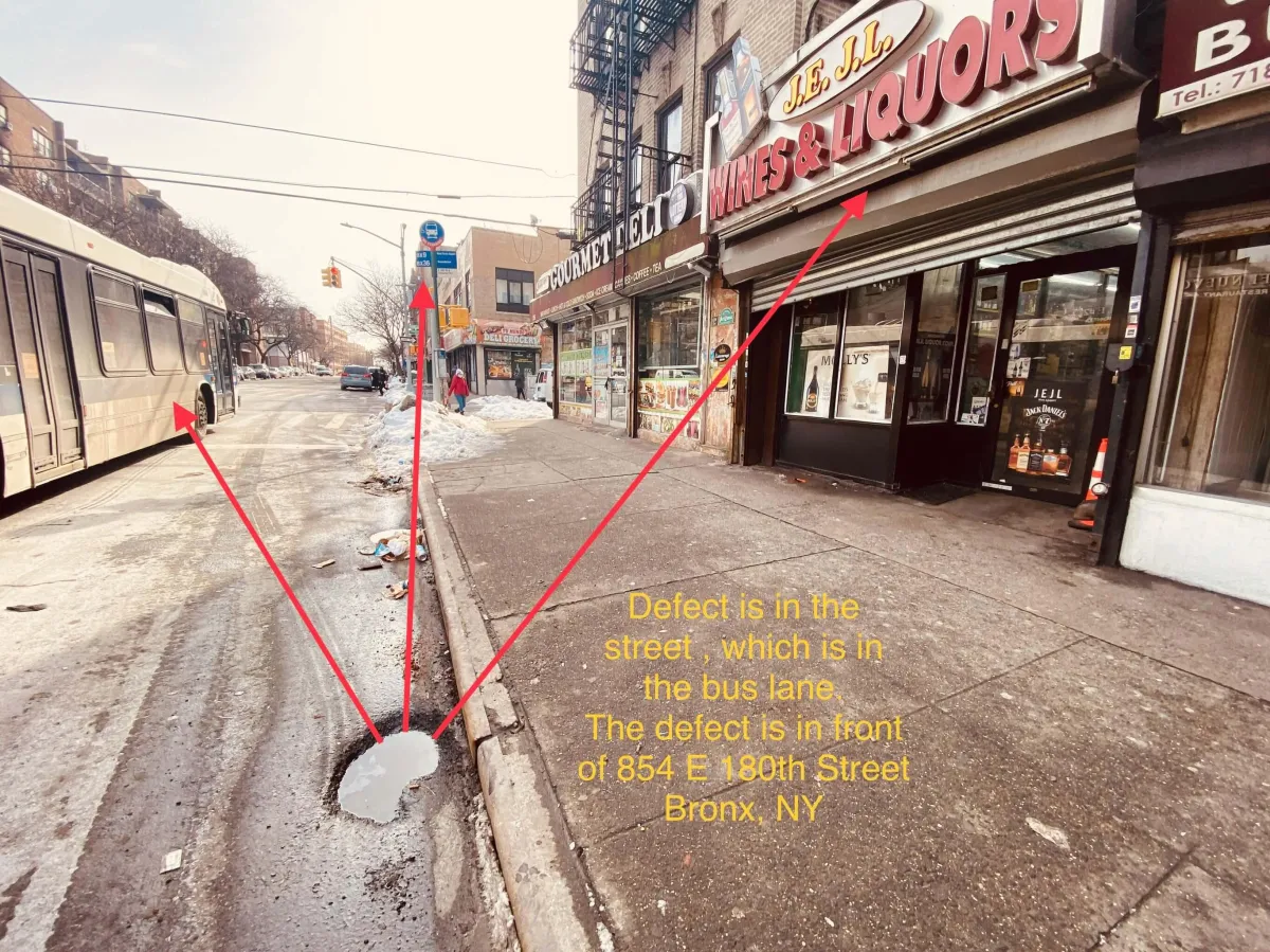 A marked-up investigator image of a defective roadway in South Bronx, where our client was injured, representing legal services for roadway defect accidents, trip and fall injuries, and premises liability claims.