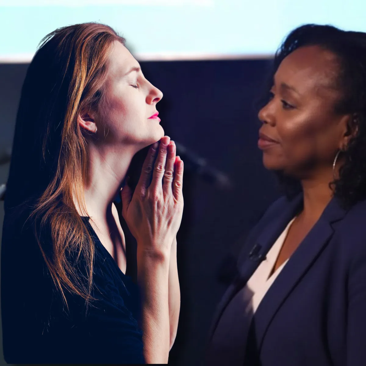 two women praying together
