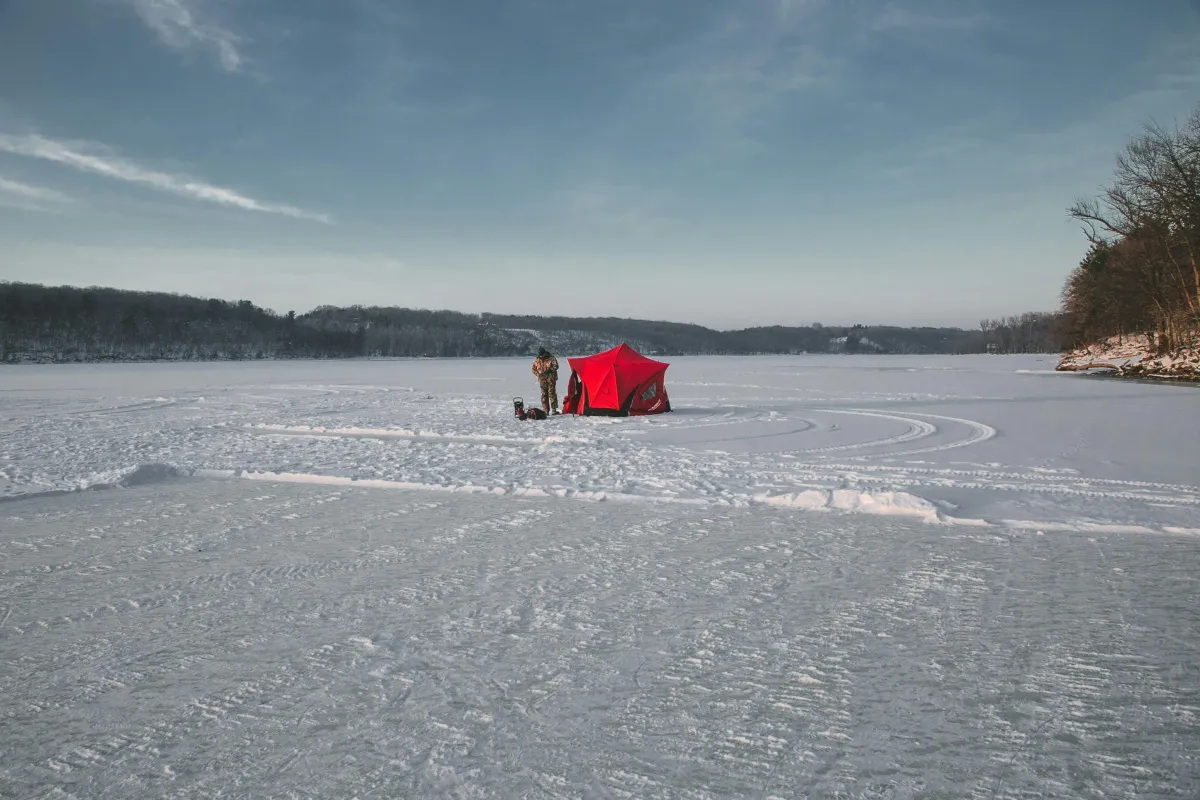 tent and man in ice lake