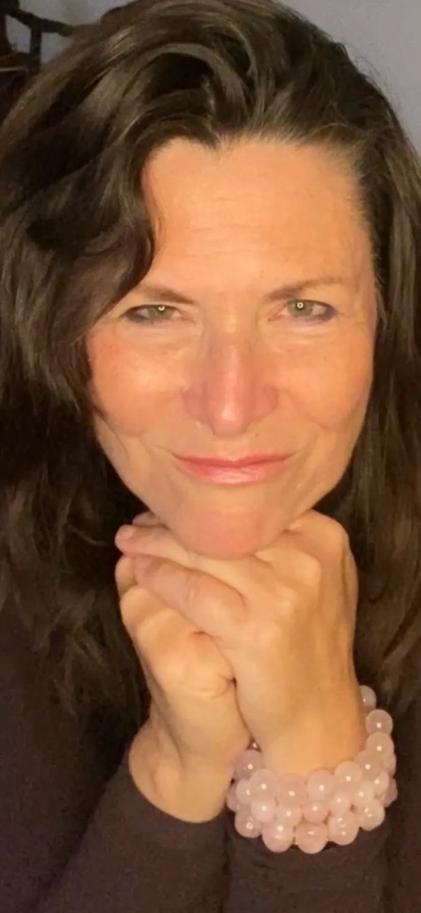 A warm, empathetic coaching professional speaking with a parent