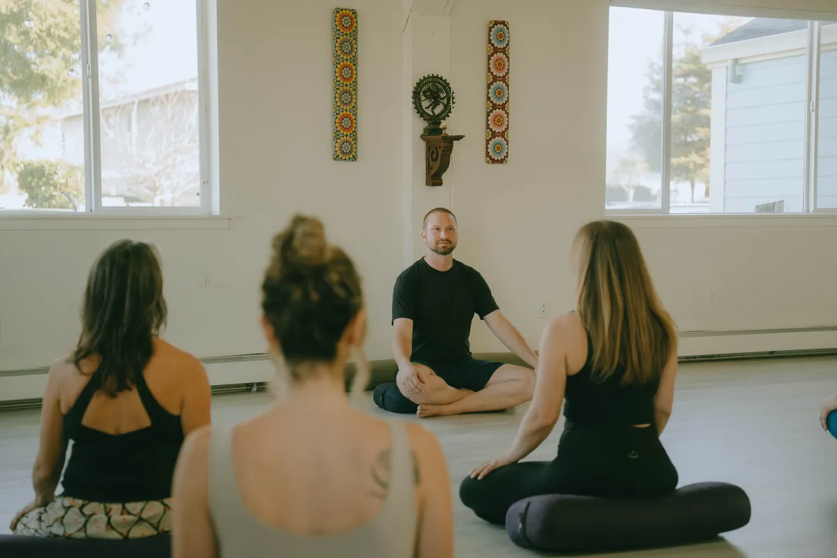 Restorative yoga setup with organic cotton bolsters and gentle ambient lighting