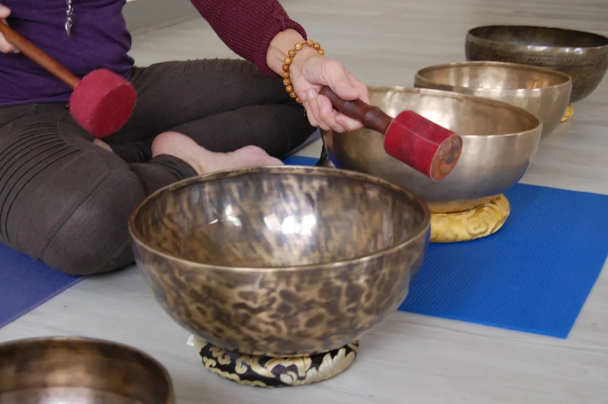 Quiet meditation cushions arranged in a circle on natural hardwood studio flooring